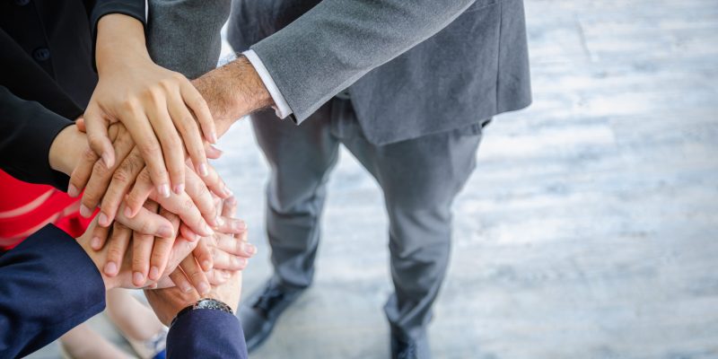 close up business people putting their hands together.Unity and teamwork concept.